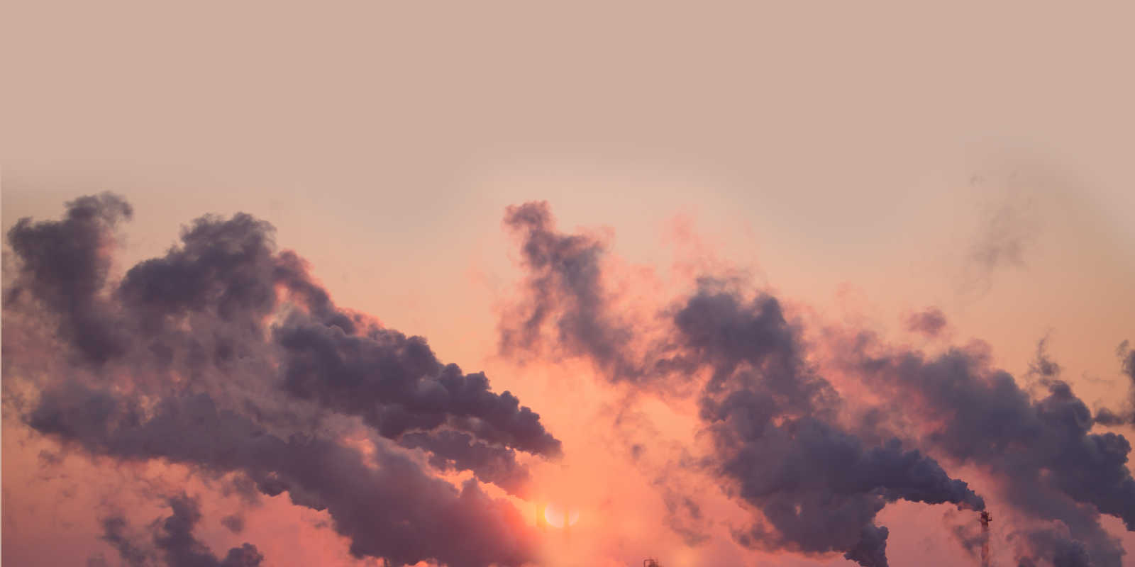 Smoke from chimneys fills the sky