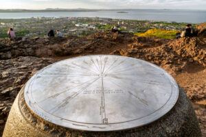 People on the top of Arthurs Seat overlooking Edinburgh