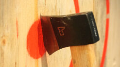 Axe stuck in a wooden target