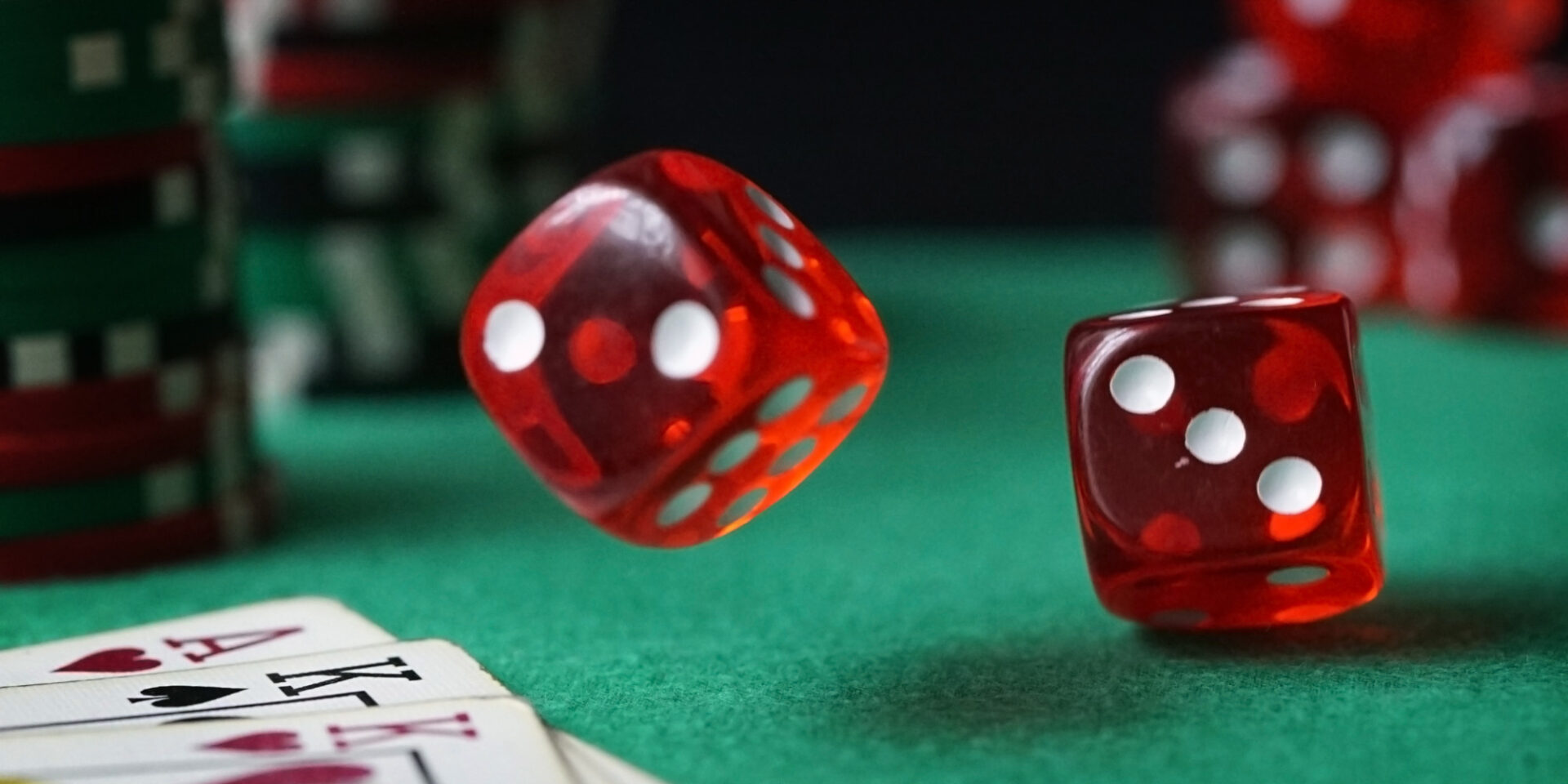 Red dice, playing cards and casino chips