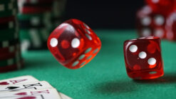 Red dice, playing cards and casino chips
