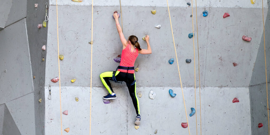 Woman at climbing centre