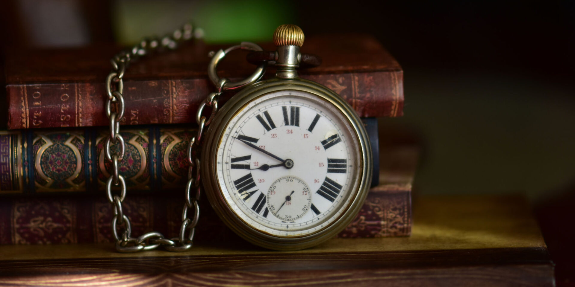Old books and a pocket watch