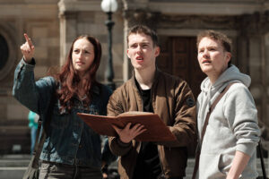 Three people on a city trail in Edinburgh