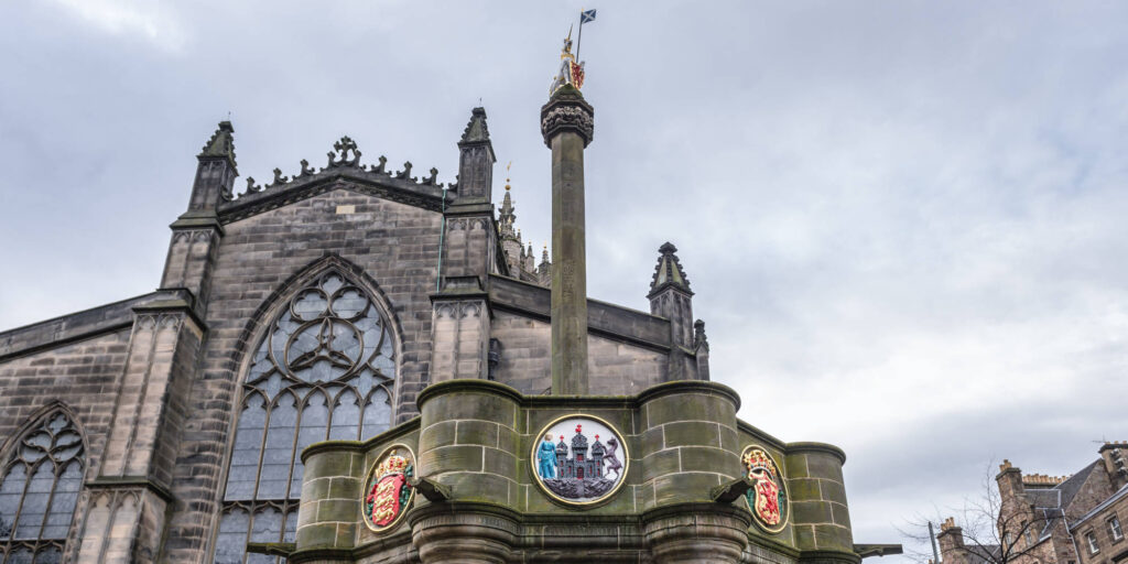 The Mercat Cross in front of St Giles Cathedral in Edinburgh