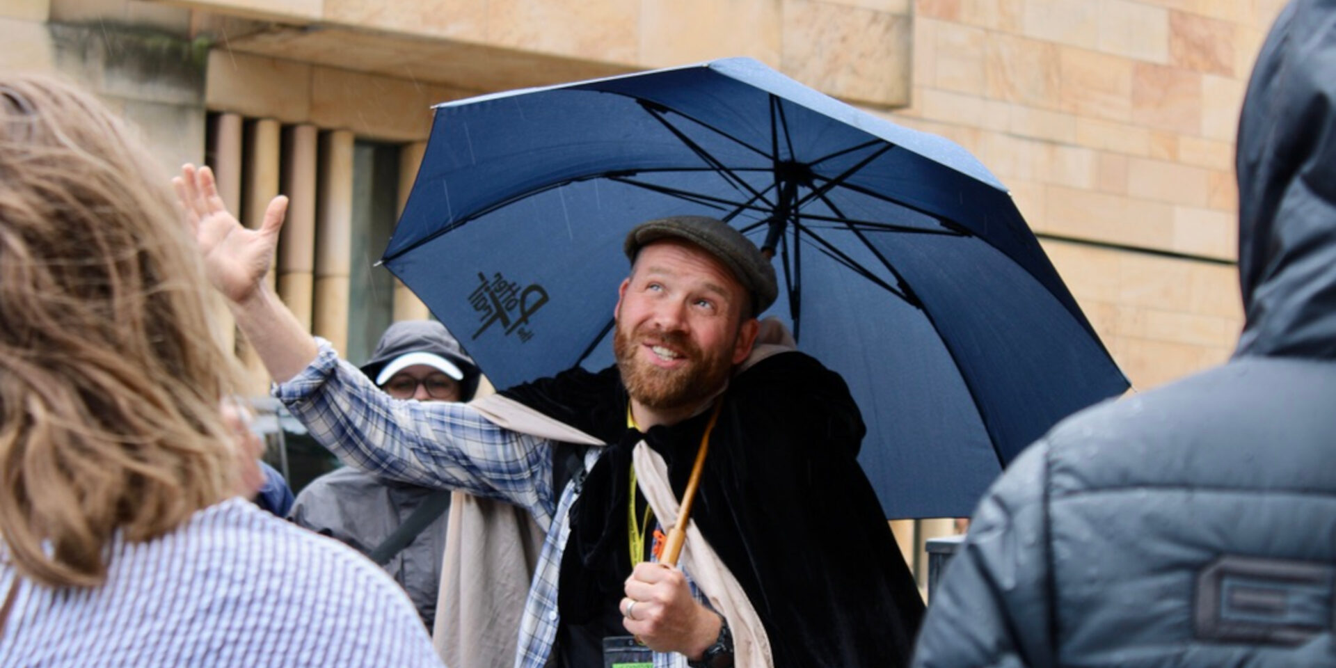 Tour guide under an umbrella in Edinburgh