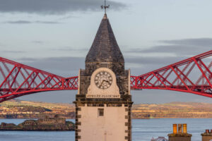 Clock tower in South Queensferry, with the Forth Bridge behind