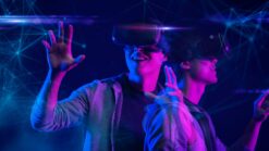 Two people wearing VR headsets